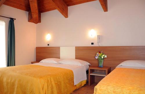 Een bed of bedden in een kamer bij Hotel Edera