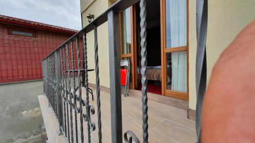 a balcony of a house with a railing at Pensiunea SADA in Făgăraş