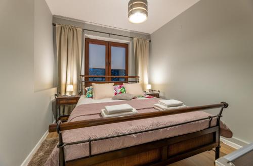 Giường trong phòng chung tại Apartament Gromadzyń