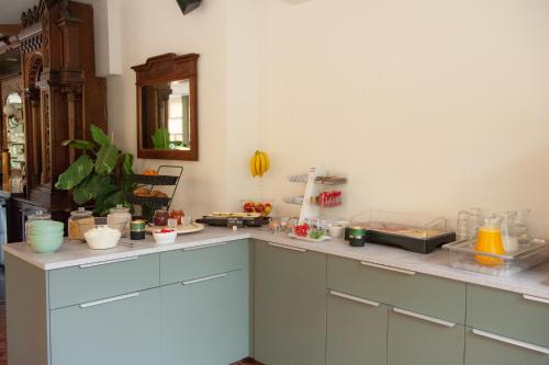 a kitchen with a counter with alot of items on it at B&B Brakke Berg in Berg en Terblijt