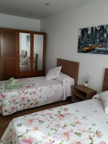 Ένα ή περισσότερα κρεβάτια σε δωμάτιο στο Casa Abenelas