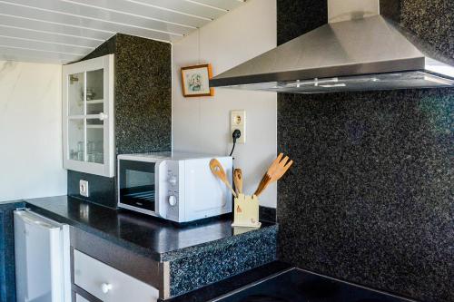 Kuchyň nebo kuchyňský kout v ubytování Chalet Den Keibilk