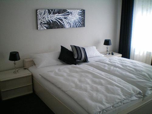 Postel nebo postele na pokoji v ubytování Hotel Stadt Coblenz