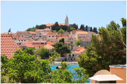 a view of a town with a river and buildings at Studio Apartman Elena in Primošten