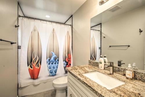 a bathroom with surfboards on the shower curtain at Coastal Carlsbad Home 1 Mi to Beach and Downtown in Carlsbad