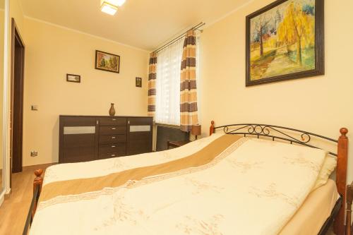 Postel nebo postele na pokoji v ubytování Apartament Kapitański