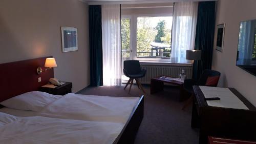 Postel nebo postele na pokoji v ubytování Landhotel Ridder