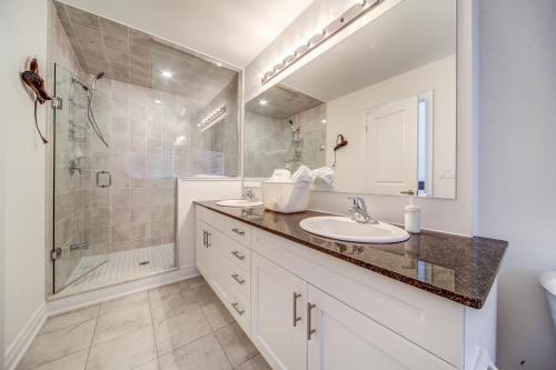 a bathroom with a sink and a shower at Executive Town Home-Mountain View-Historic Snowbridge Village, Walking Distance to the Resort in Collingwood