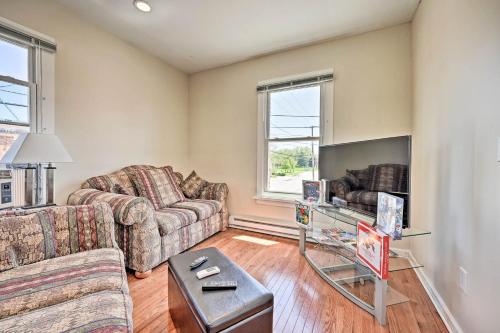 a living room with two couches and a tv at 3 Mi to Lake Michigan Pet-Friendly Apt in Sawyer in Sawyer