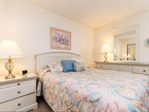 Ένα ή περισσότερα κρεβάτια σε δωμάτιο στο Island Echos 4th-5th Floor Condos