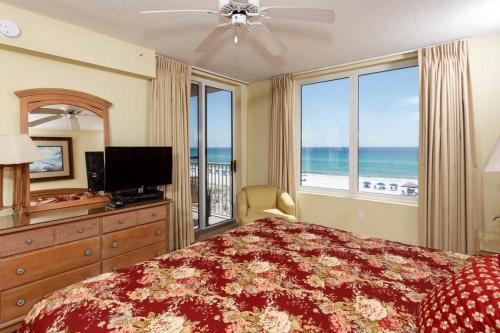 a bedroom with a large bed with a view of the ocean at Island Princess Condos in Fort Walton Beach