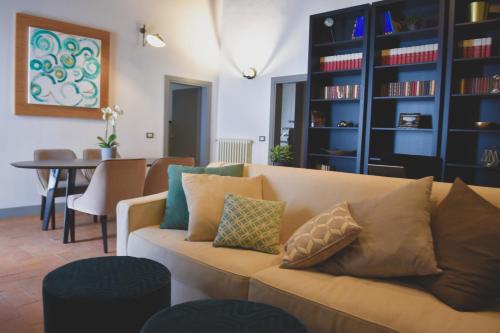 a living room with a couch and a table at Del Giglio's Luxury apartment in Piazza della Signoria in Florence