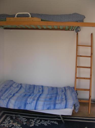 Кровать или кровати в номере studette indépendante