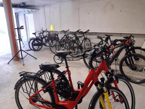 a bunch of bikes parked in a garage at Hotel Hubertus in Sankt Johann im Pongau