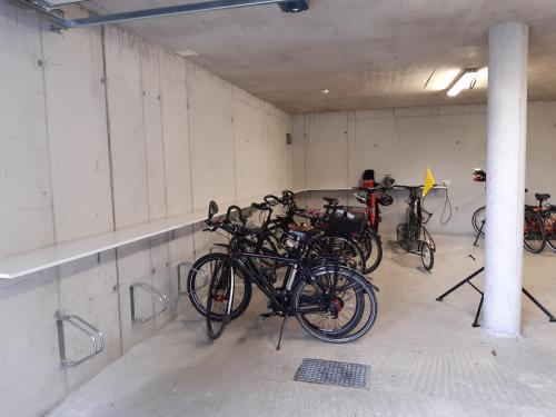 a group of bikes parked in a garage at Hotel Hubertus in Sankt Johann im Pongau