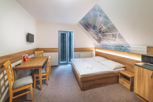 Postel nebo postele na pokoji v ubytování Apartmány Zaria