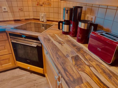 a kitchen with a counter top with a stove top oven at Chalet Zugspitze in Grainau
