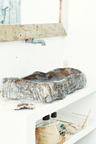 a fish on a shelf with a basket on it at Lambo Homestay in Waikabubak
