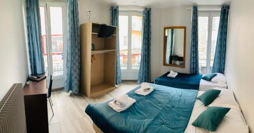 Postel nebo postele na pokoji v ubytování Hotel le Nice Etoile
