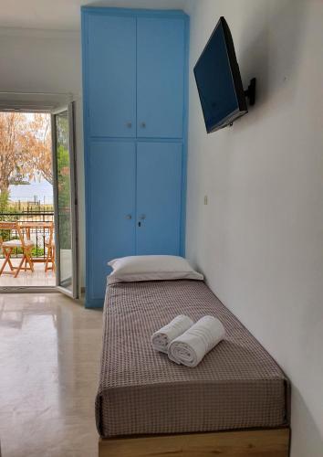 Ένα ή περισσότερα κρεβάτια σε δωμάτιο στο Aristotelis Studios