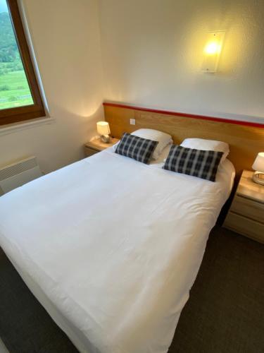Postel nebo postele na pokoji v ubytování Sancy Resort