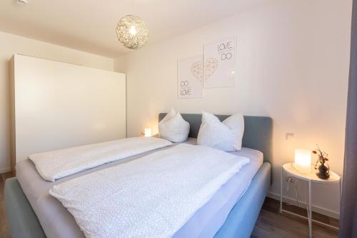Postel nebo postele na pokoji v ubytování Ferienwohnung Vergissmeinnicht