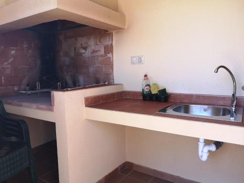 Virtuvė arba virtuvėlė apgyvendinimo įstaigoje Casas Rurales La Loma