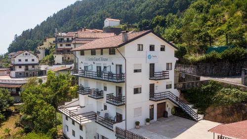 an aerial view of a building in a village at Gerês Guest House in Geres