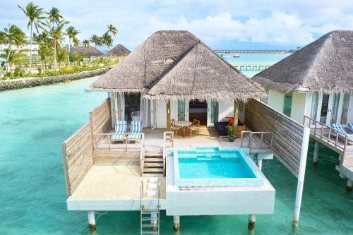 a villa on the water with a swimming pool at Sun Siyam Iru Veli - 24 Hours Premium All-Inclusive with Free Transfers in Dhaalu Atoll