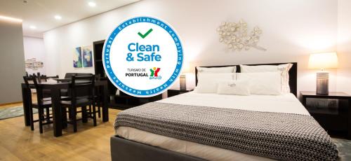 a sign for a clean and safe room with a bed at Bugalha My Loft Douro 4 in Peso da Régua