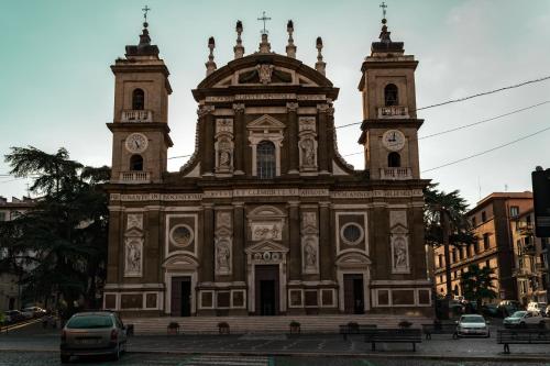 a large building with two towers with clocks on it at Antica Terrazza Frascati in Frascati