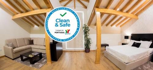 a room with a sign for a clean and safe apartment at Bugalha My Loft Douro 10 in Peso da Régua