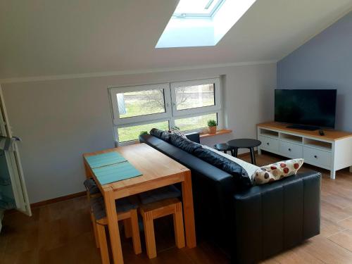 Un televizor și/sau centru de divertisment la Oberland-Ferienwohnung