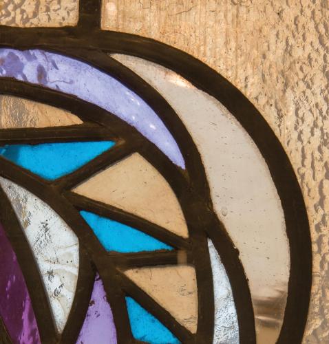 a close up of a stained glass window at Louise sur Cour in Brussels