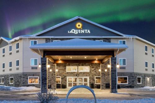 a large building with a clock on the front of it at La Quinta by Wyndham Fairbanks Airport in Fairbanks