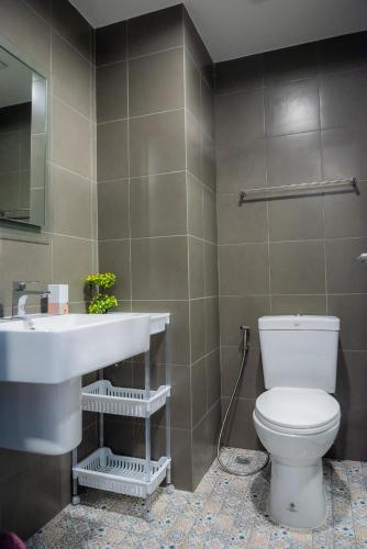 a bathroom with a toilet and a sink at Lacasita484 In Huahin in Hua Hin