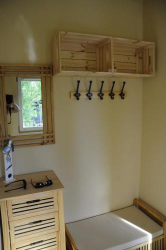a kitchen with a counter and cabinets and a window at Greenapple Apartman Badacsony in Badacsonytördemic