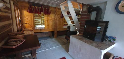 an aerial view of a living room with a fireplace at Traditional Casa Pescarului langa lac cu ponton in Colibiţa