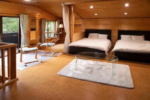 Säng eller sängar i ett rum på Foresta Karuizawa 1