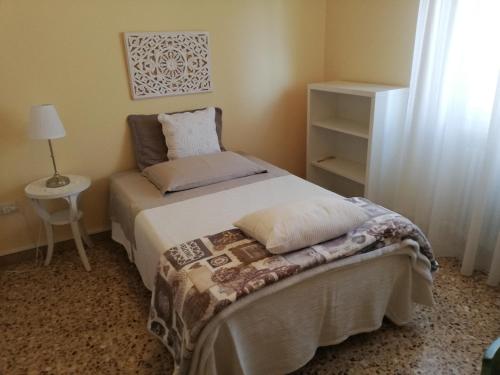 Кровать или кровати в номере LA COQUILLE appartamento vicino all'ospedale