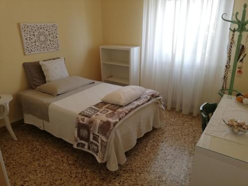 Кровать или кровати в номере LA COQUILLE appartamento vicino all'ospedale