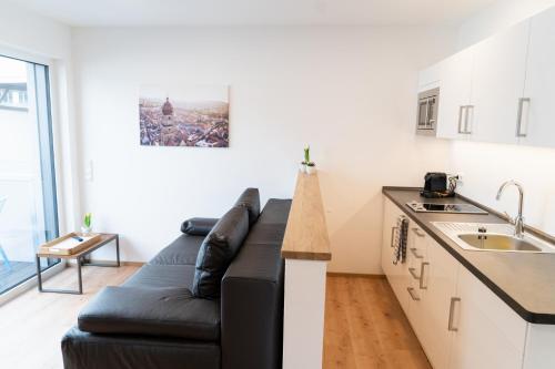 Kuchyň nebo kuchyňský kout v ubytování AMBERG APART - Apartment B - Wohnraum auf Zeit