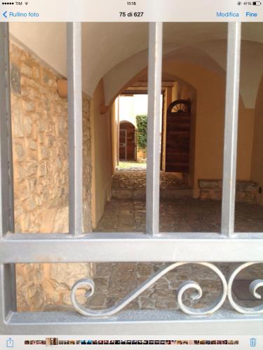 a window of a house with a stone wall at Bed And Breakfast Mblò in Fondi