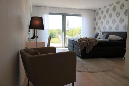 a living room with a bed and a couch at Lessing31 in Schotten