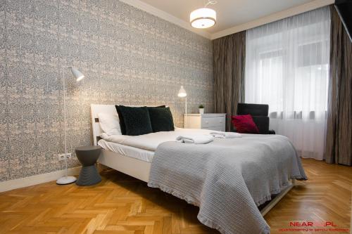 Postel nebo postele na pokoji v ubytování Apartment Nearto Old Town Daszyńskiego street