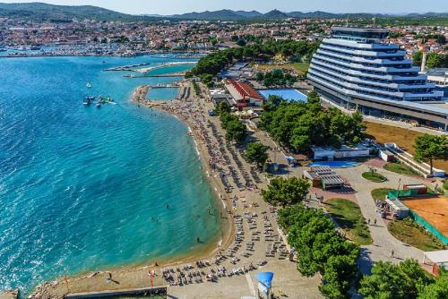 an aerial view of a beach and the ocean at Apartments Gardijan in Vodice