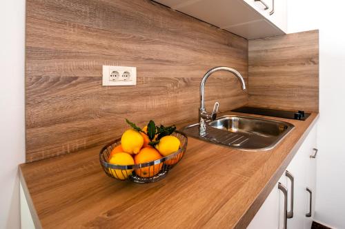 Kuchyň nebo kuchyňský kout v ubytování Apartments Carmelo