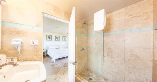a bathroom with a shower and a sink at Lime Tree Bay Resort in Islamorada