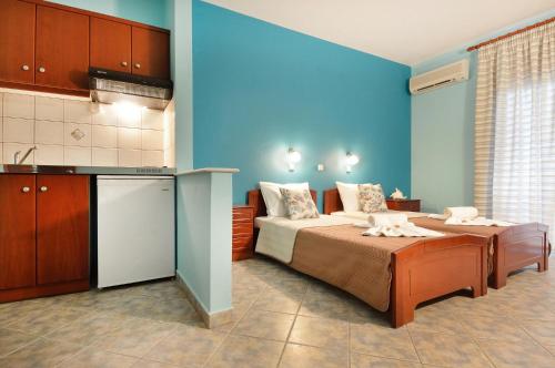 Postel nebo postele na pokoji v ubytování Hotel Stefanos