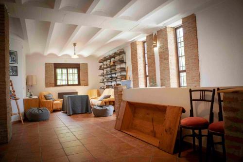 a living room with a table and chairs at Caserío Lo Bulle in Oria
